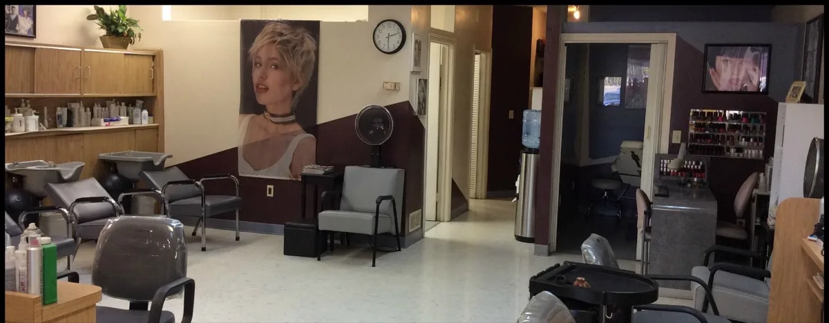 Inside Salon Monte Carlo, styling stations and shampoo bowls