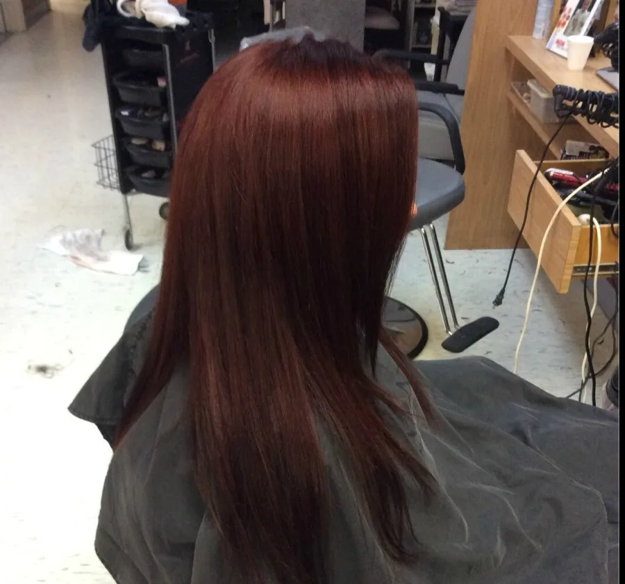 Vibrant red hair color by Salon Monte Carlo